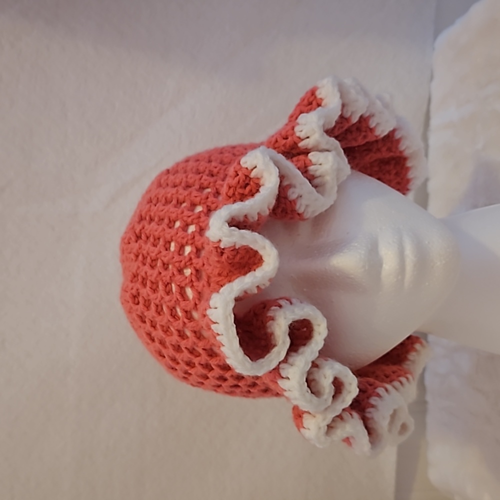 Womens pink / white homemade crochet bucket hat with ruffles.